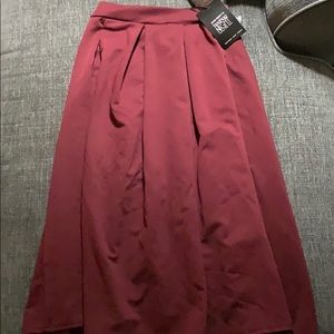 Berry colored mid length skirt